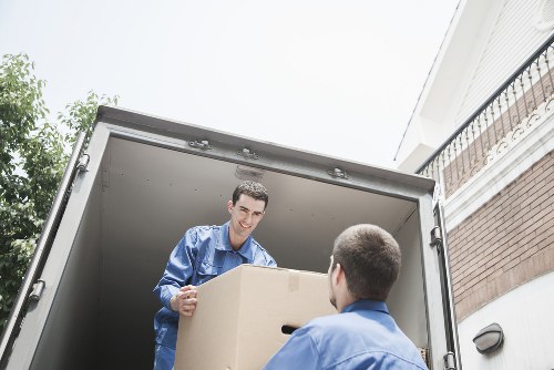 Professional man and van team focusing on safe moving practices
