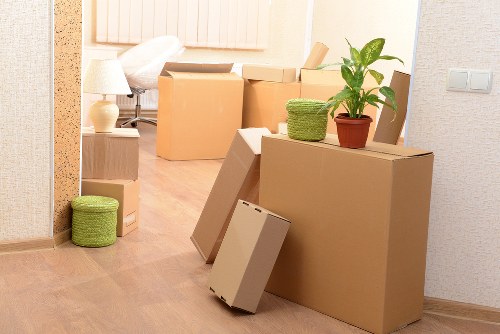 Organised moving boxes labelled by room for unpacking in an Eastcote property
