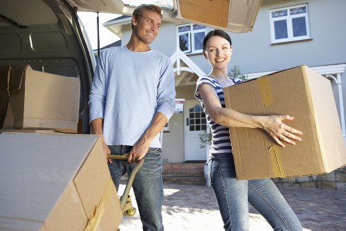 Professional movers loading furniture from an Eastcote home